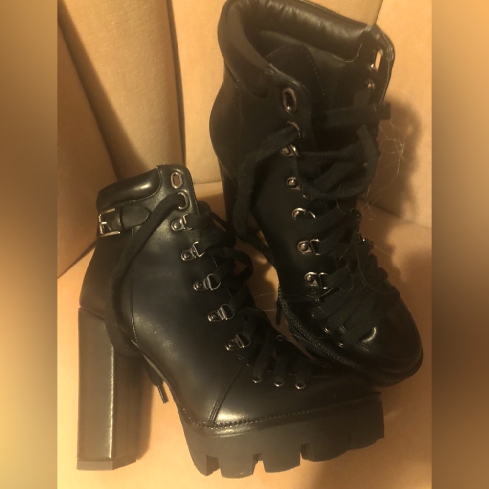 Black Booties . Never worn amazing quality